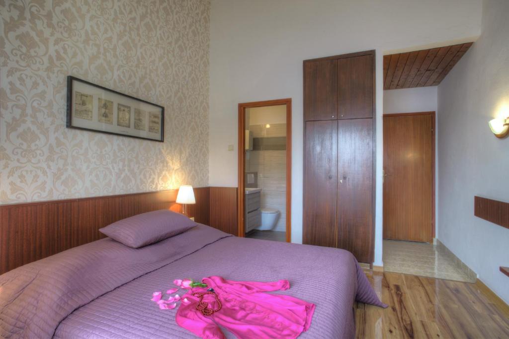 Postel nebo postele na pokoji v ubytování Gina Bed & Breakfast