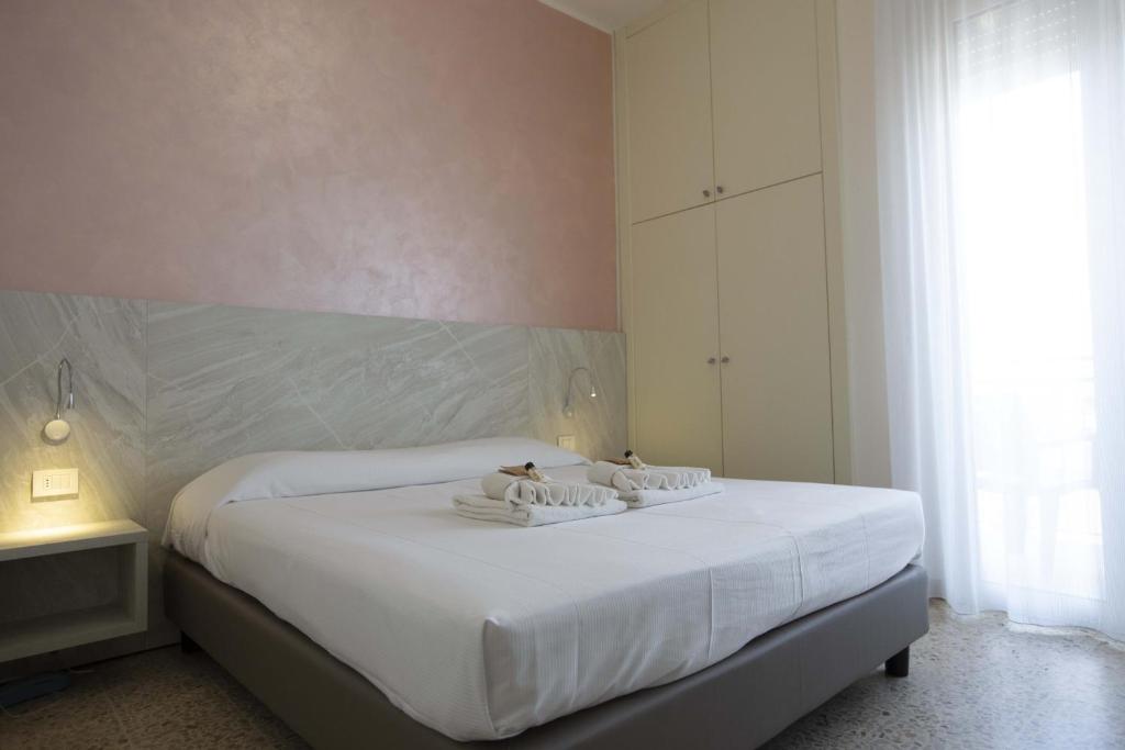Postel nebo postele na pokoji v ubytování Hotel Confort