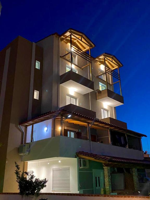 a large building with lights on top of it at Sea's Villa in Ksamil