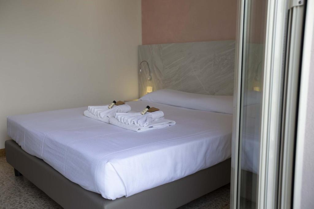 Postel nebo postele na pokoji v ubytování Hotel Confort