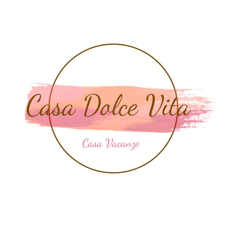 a label for a wine bottle with a pink and pink stripes at Casa Dolce Vita in Ventimiglia