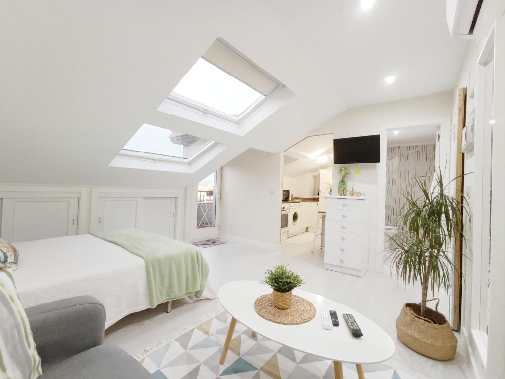 Ένα ή περισσότερα κρεβάτια σε δωμάτιο στο Coqueto estudio en Sanxenxo