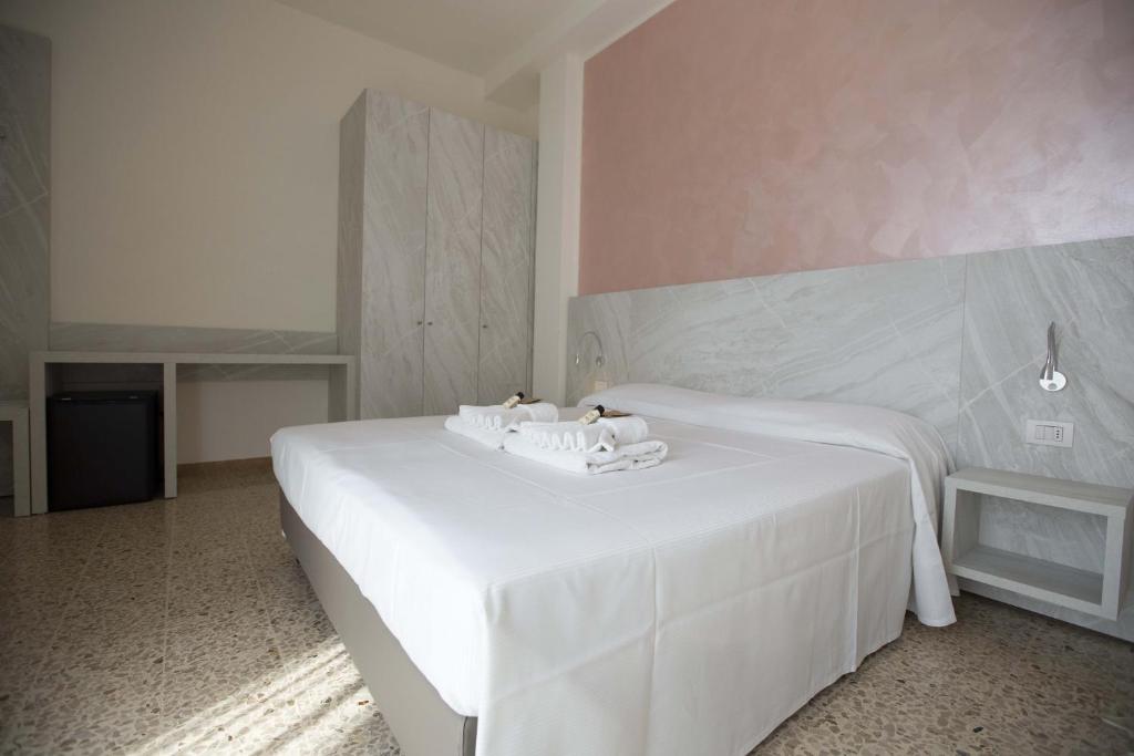 Postel nebo postele na pokoji v ubytování Hotel Confort
