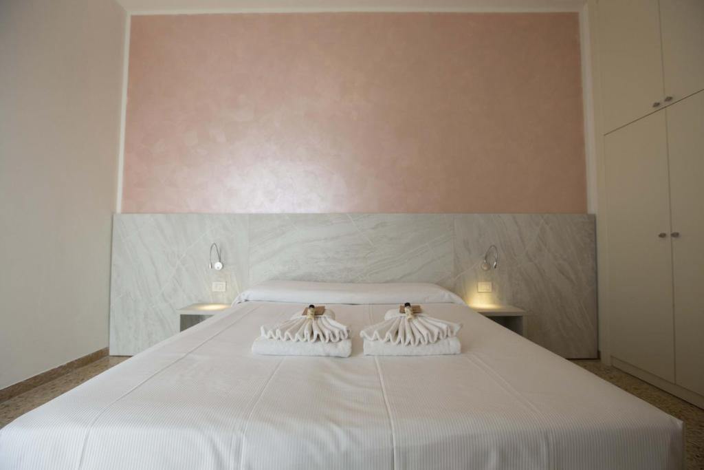 Postel nebo postele na pokoji v ubytování Hotel Confort