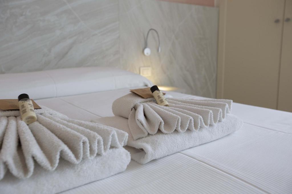 Postel nebo postele na pokoji v ubytování Hotel Confort