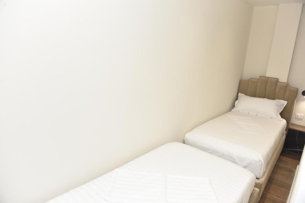 Uma cama ou camas num quarto em Hotel Royal