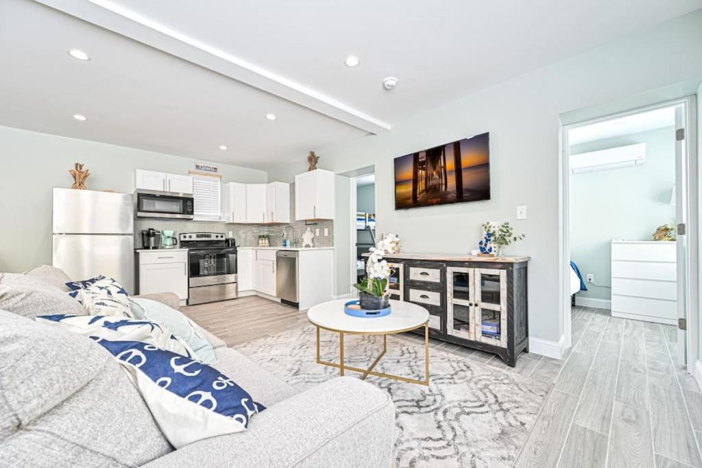 a living room with a couch and a table at 318 E Youngs Ave Unit 1 Seaside Serenity Salty Shore Retreat in Wildwood
