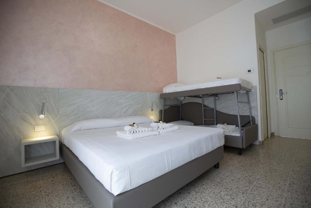 Postel nebo postele na pokoji v ubytování Hotel Confort