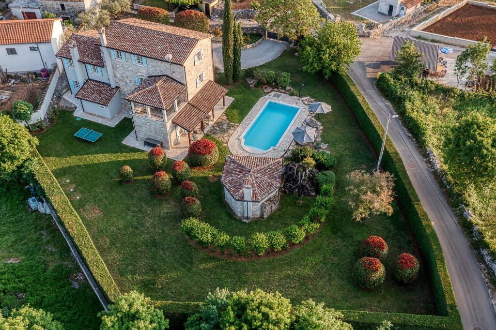 an aerial view of a house with a swimming pool at Villa Paolina in Višnjan