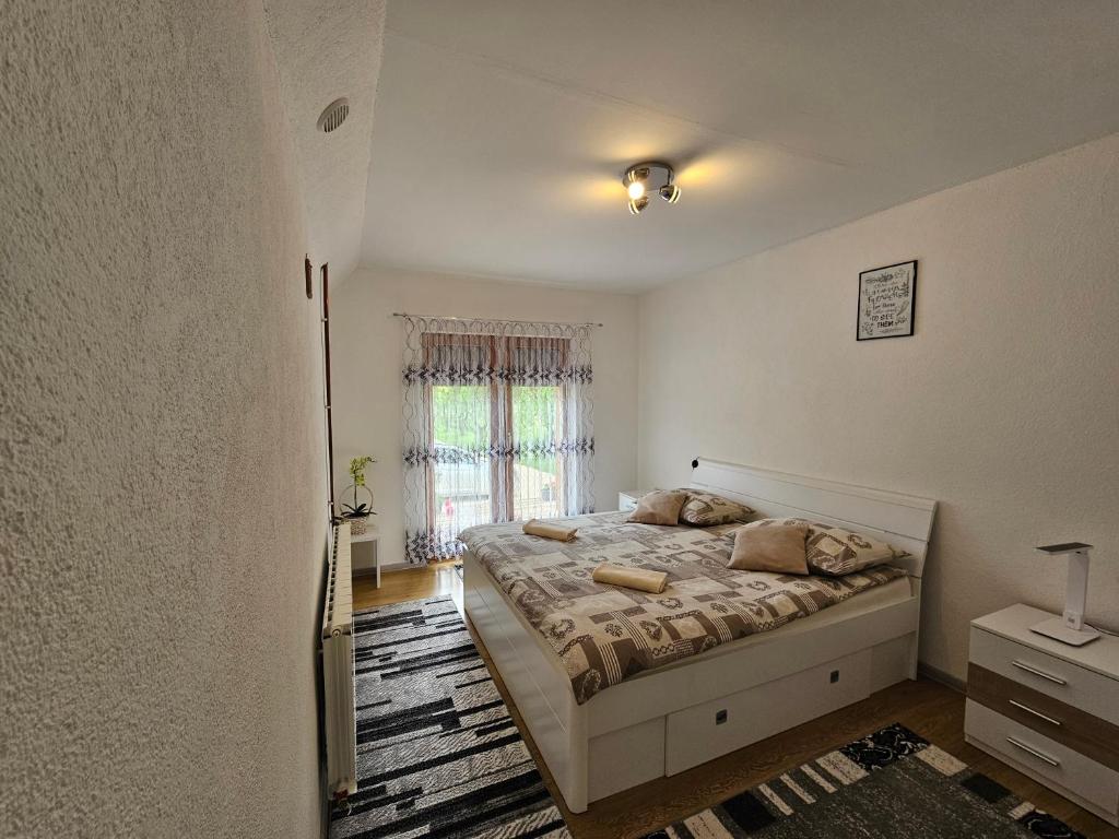 Posteľ alebo postele v izbe v ubytovaní Apartment Topalović