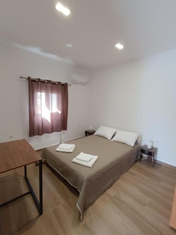 Postel nebo postele na pokoji v ubytování Selinia Residence