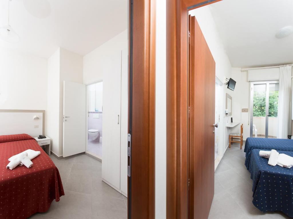 Postel nebo postele na pokoji v ubytování Hotel Real