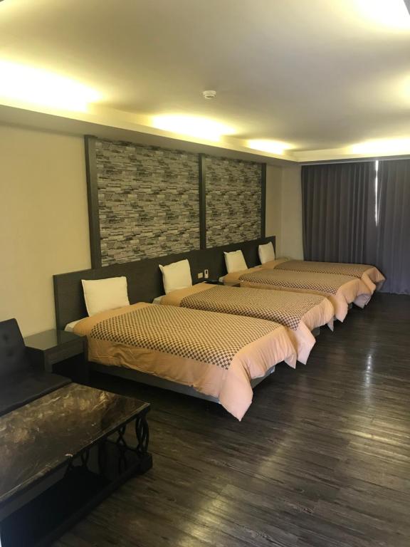 Postel nebo postele na pokoji v ubytování Carnival Motel