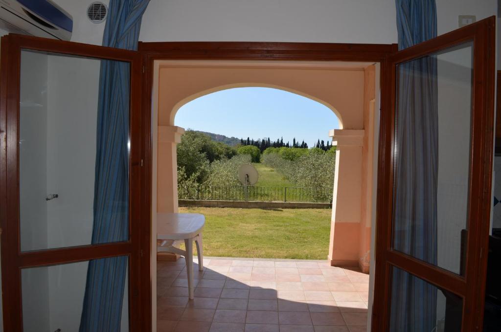 a door leading to a patio with a view at Chia Holiday Home in Chia