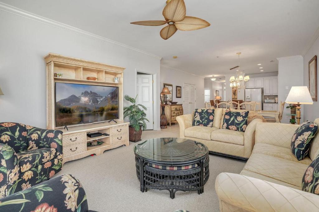 a living room with a couch and a tv at Sunset Island Luxury 3BR Unit – Free Linen Package in Ocean City