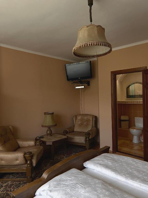 Postel nebo postele na pokoji v ubytování Вілла де Кампо