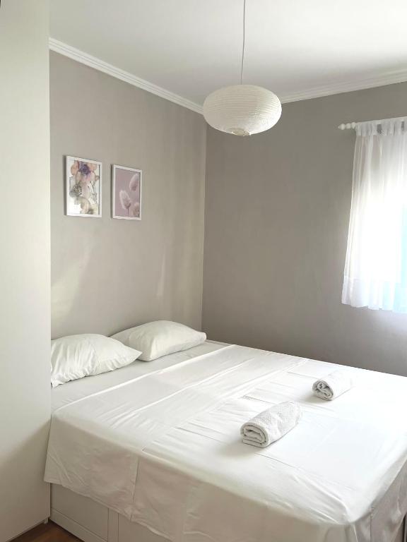 Postel nebo postele na pokoji v ubytování Apartments Keko