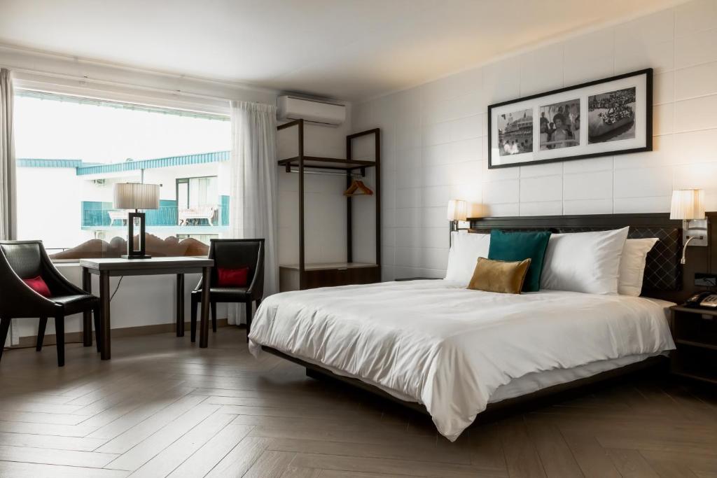 Postel nebo postele na pokoji v ubytování Capricorn Hotel Suva