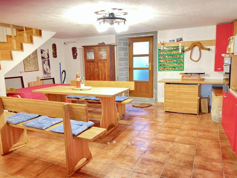 a kitchen with a table and a dining room at Relax house near Croatia in Piran