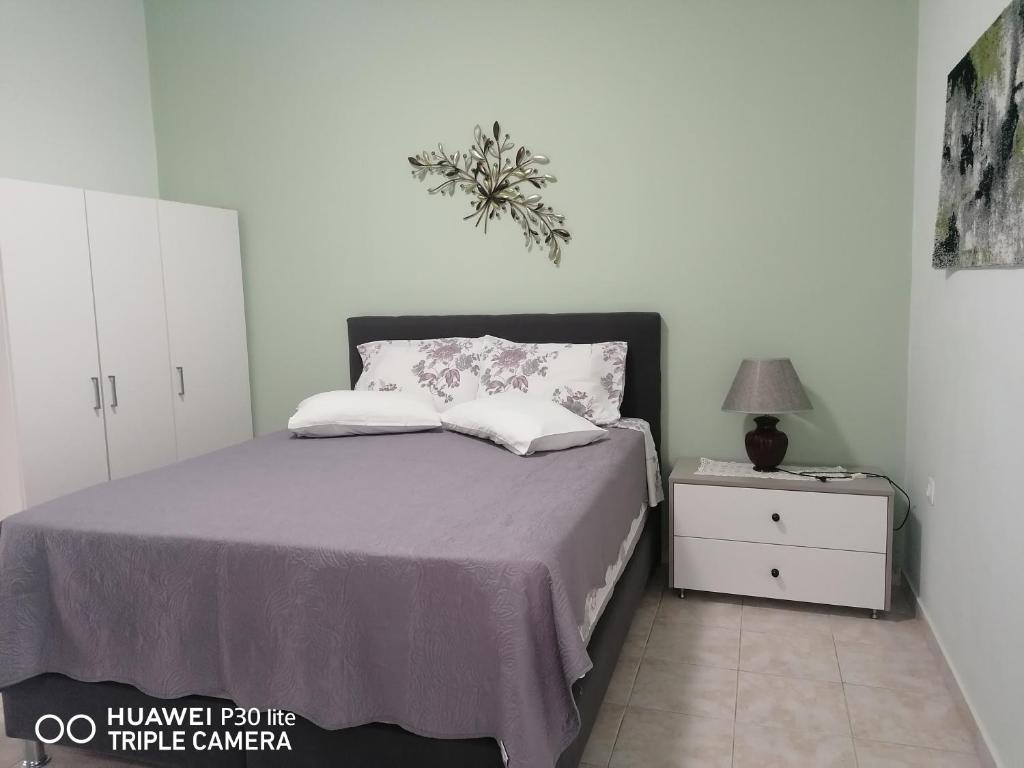 Łóżko lub łóżka w pokoju w obiekcie Green Apartments