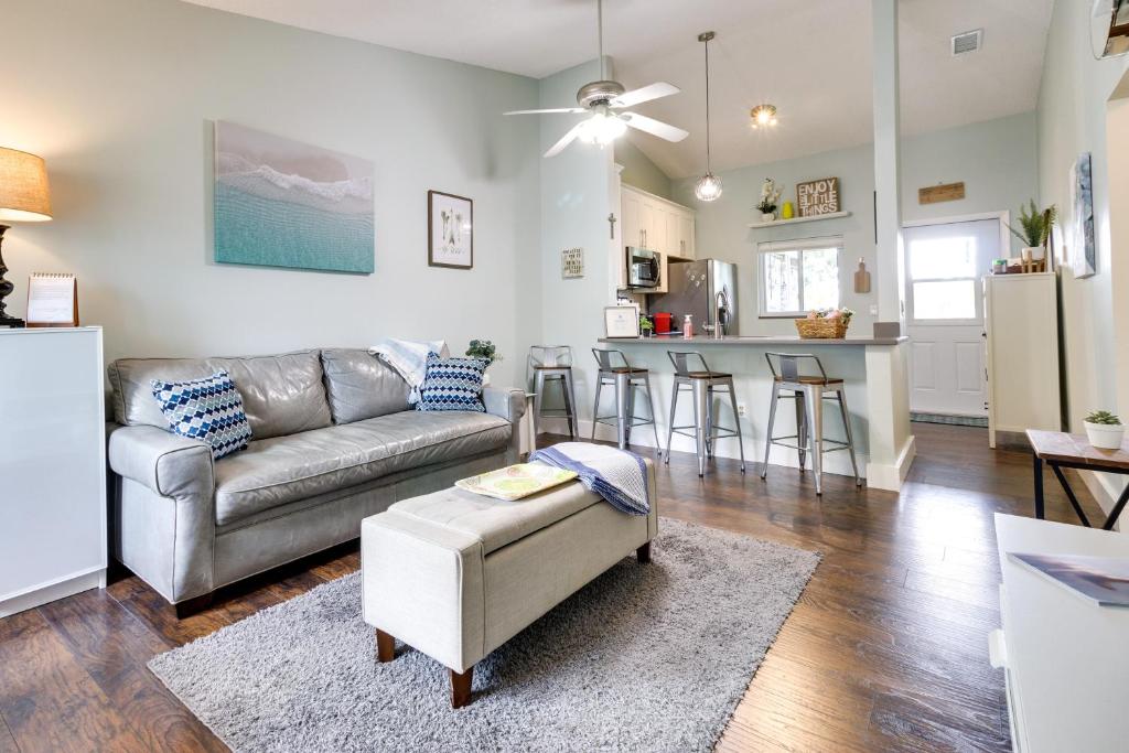 a living room with a couch and a kitchen at Pet-Friendly Orlando Home Near Hospitals in Orlando