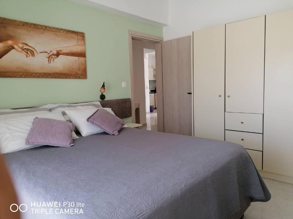 Łóżko lub łóżka w pokoju w obiekcie Green Apartments