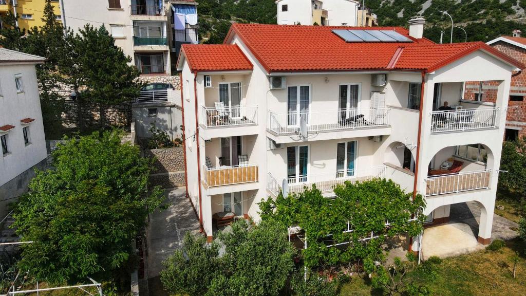 an aerial view of a building with a red roof at Apartments Antonio in Senj