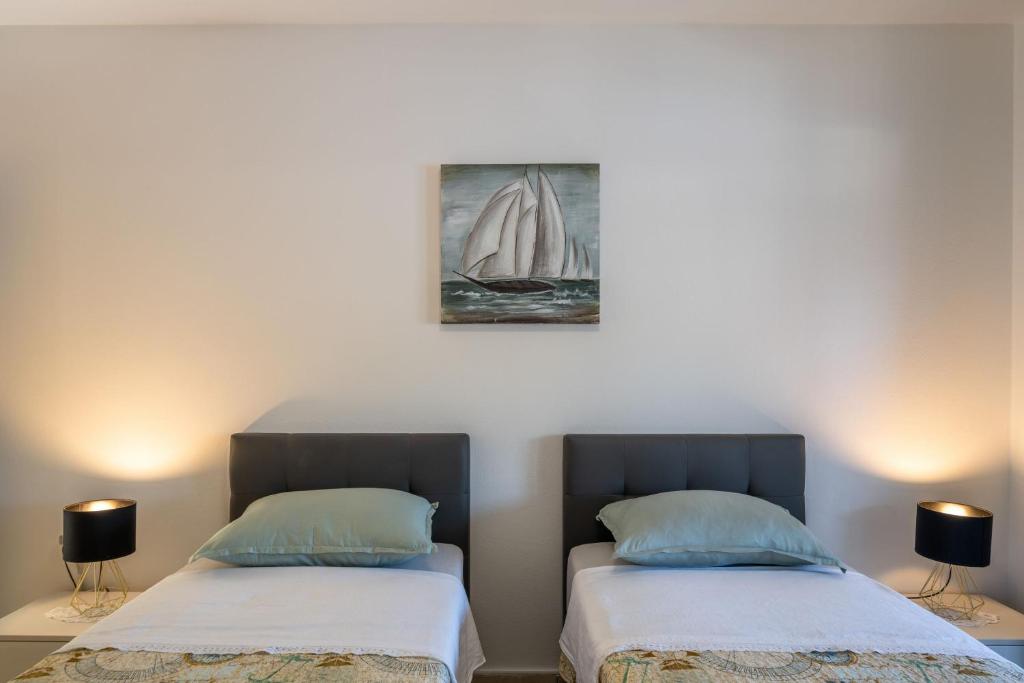 Кровать или кровати в номере Apartments Ranko