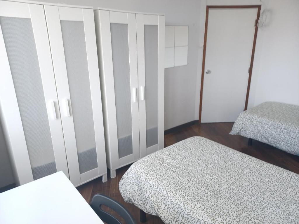 Postel nebo postele na pokoji v ubytování Oporto Sea Rooms