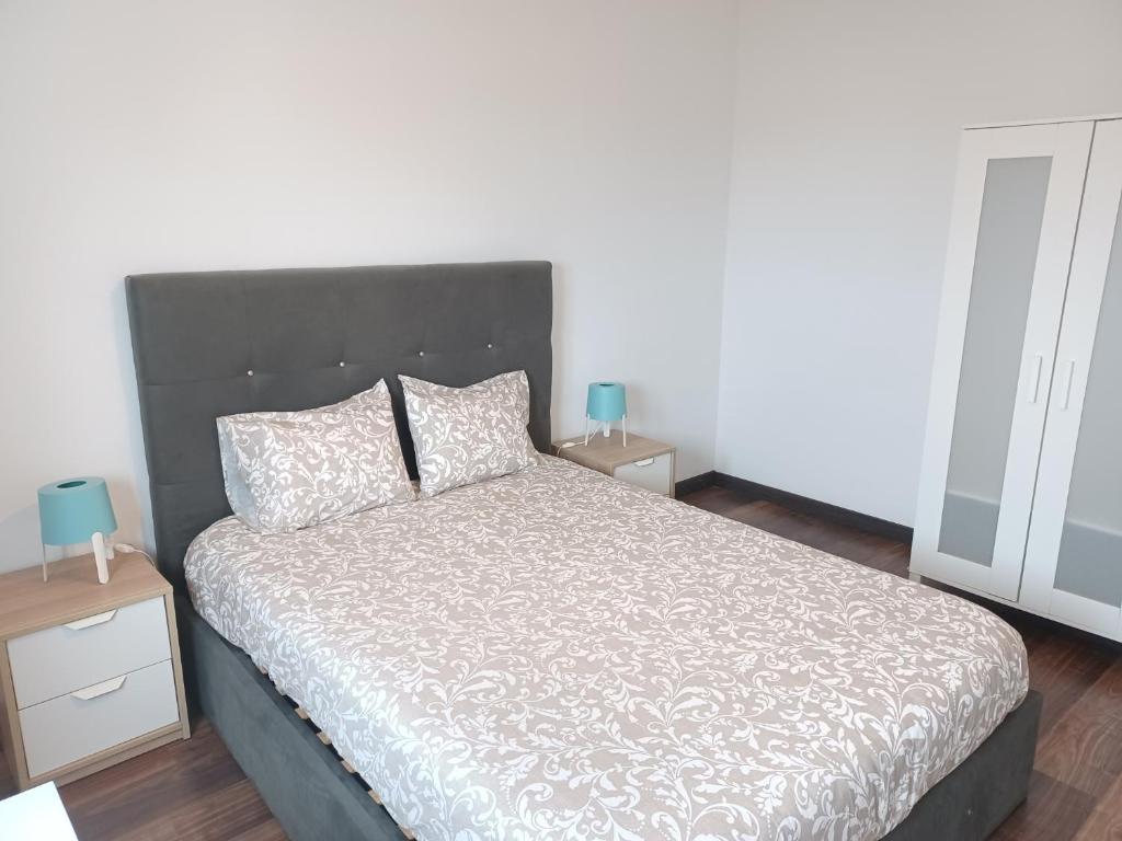 Postel nebo postele na pokoji v ubytování Oporto Sea Rooms