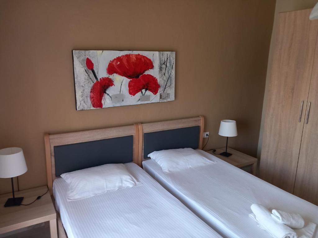 Postel nebo postele na pokoji v ubytování Lampos House Vourvourou