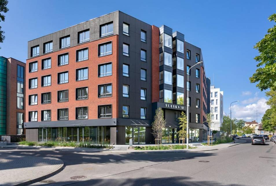 a large brick building on a city street at Slaska 12 in Gdańsk
