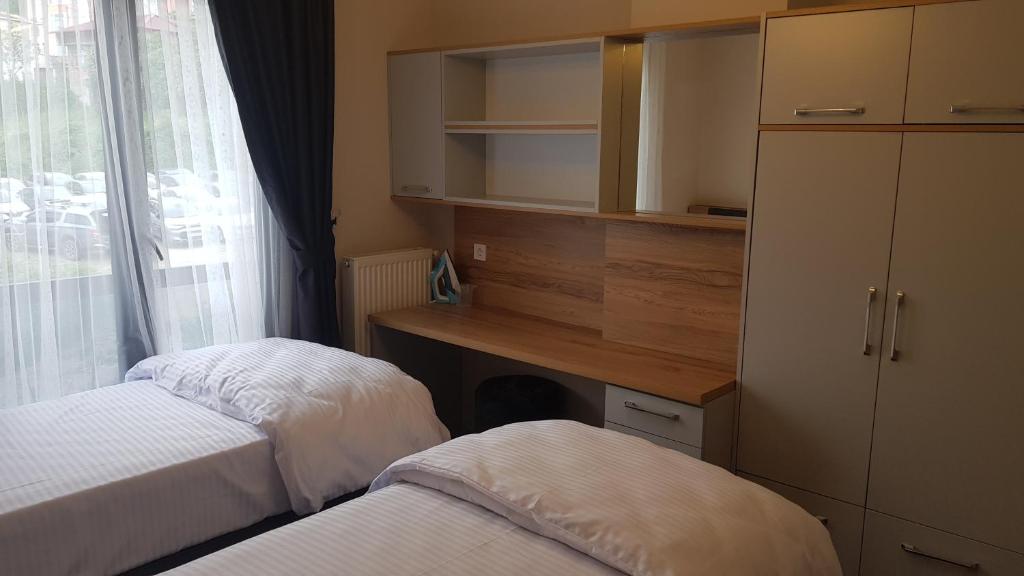 Postel nebo postele na pokoji v ubytování Guest Apart Konaklar