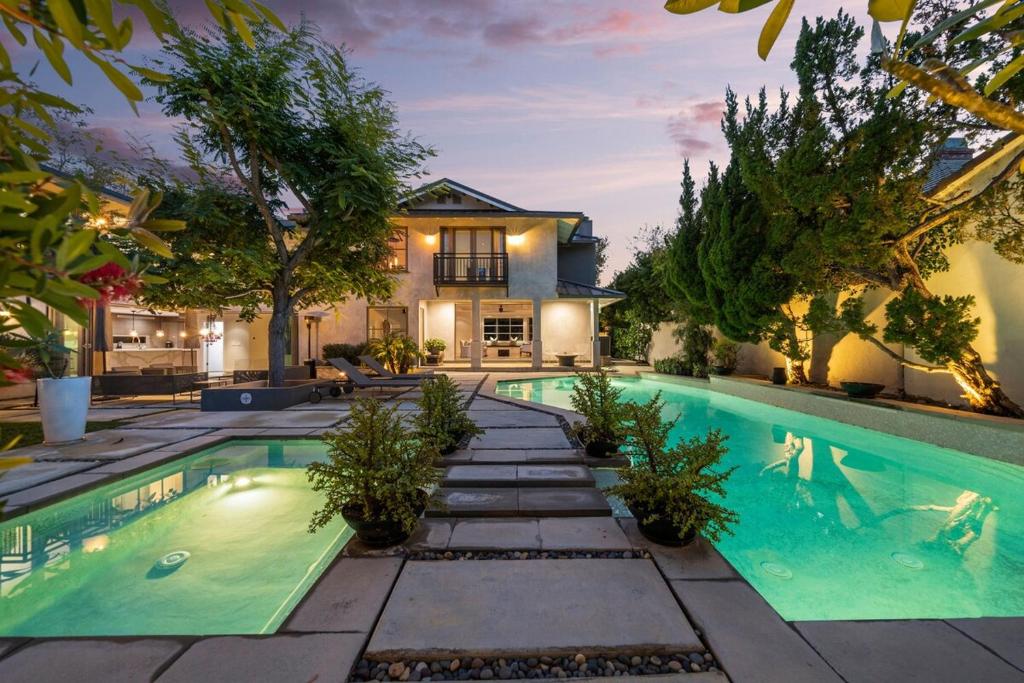 a swimming pool in the backyard of a house at Prestige Studio City Estate in Los Angeles