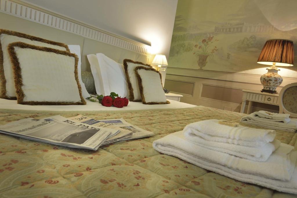 Postel nebo postele na pokoji v ubytování Palazzo Guicciardini