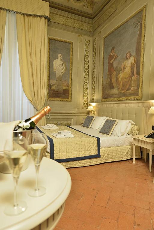 Postel nebo postele na pokoji v ubytování Palazzo Guicciardini