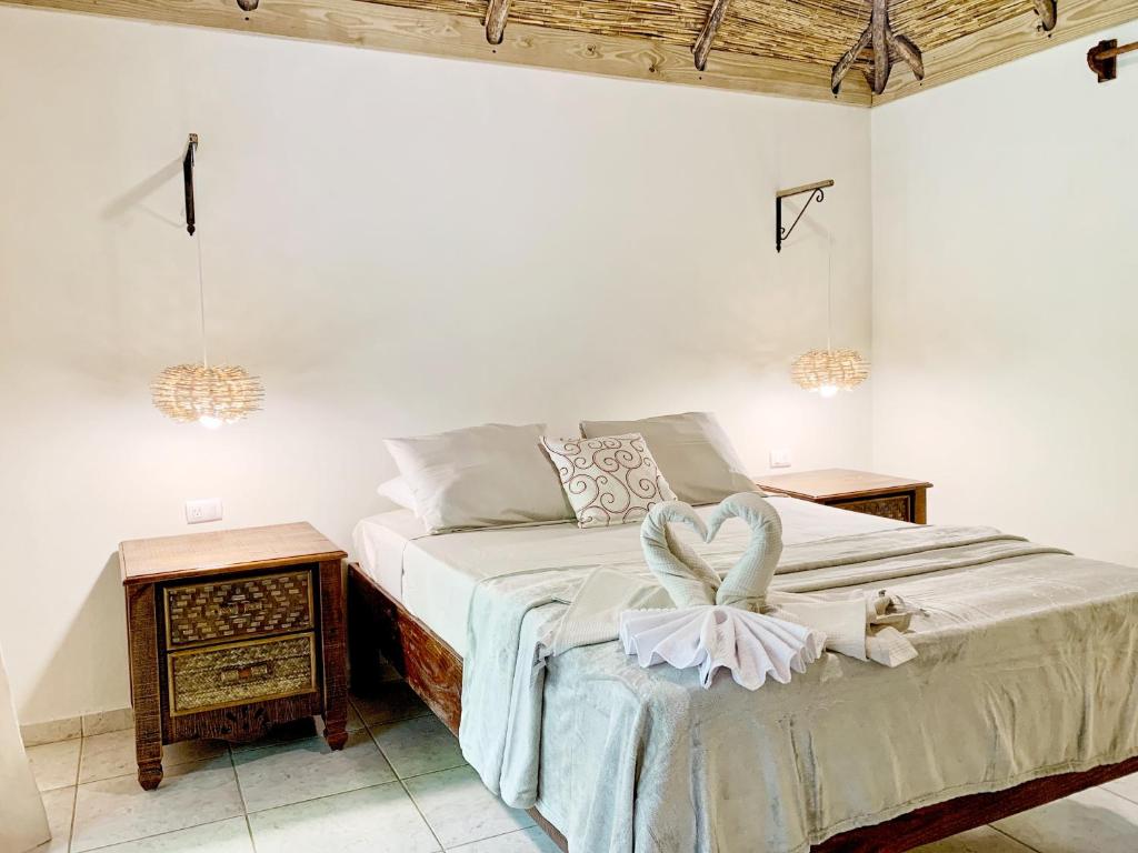 Postel nebo postele na pokoji v ubytování Surfbreak B&B