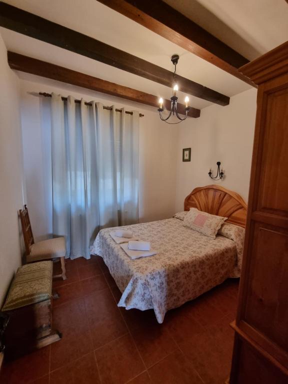 Postel nebo postele na pokoji v ubytování La Casa de Tio Claudio