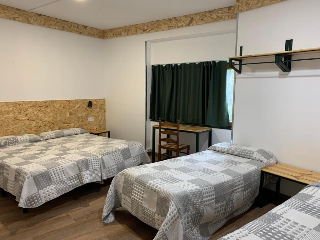 Postel nebo postele na pokoji v ubytování Hotel Or Blanc