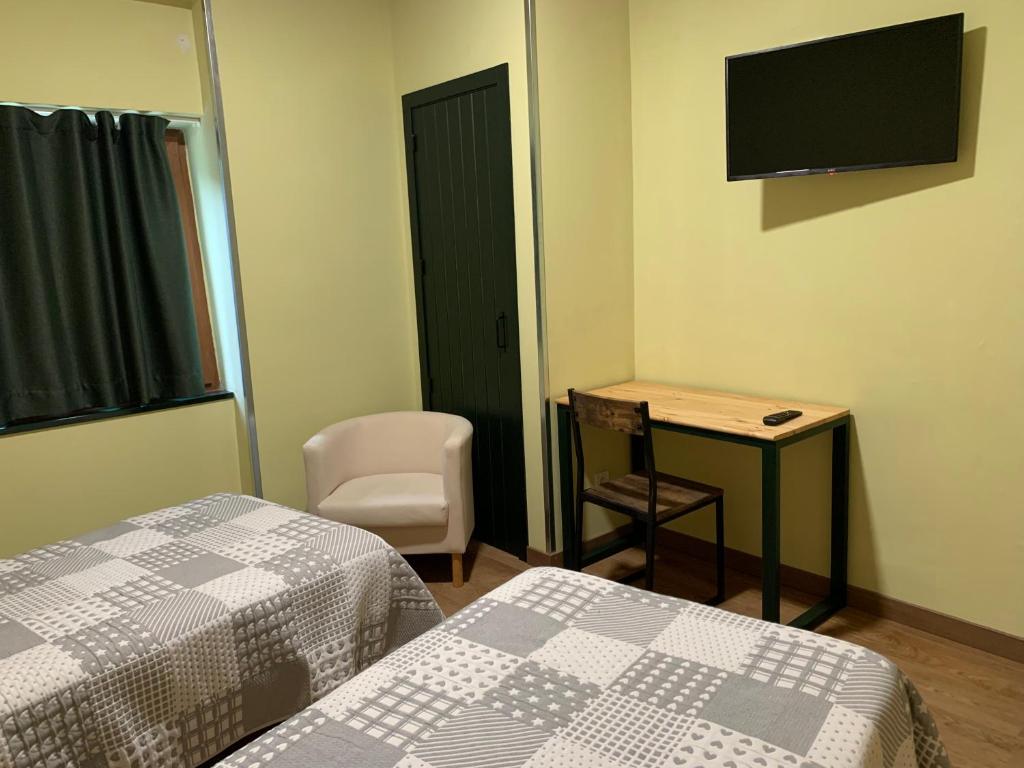 TV a/nebo společenská místnost v ubytování Hotel Or Blanc
