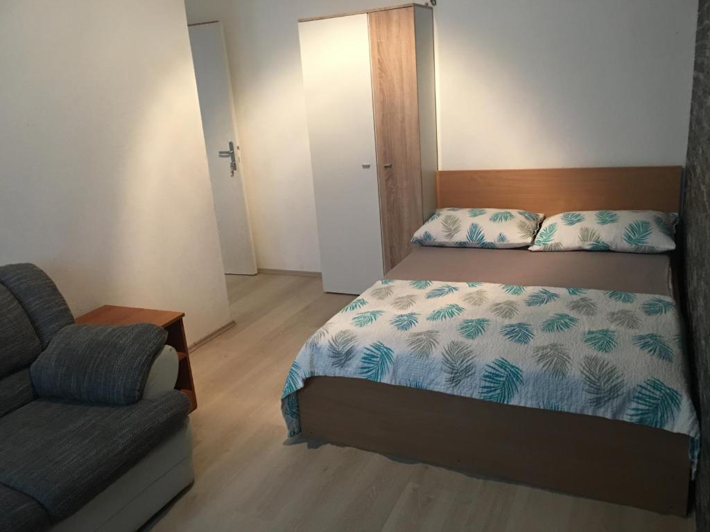 Postel nebo postele na pokoji v ubytování Apartments Sun & Sea