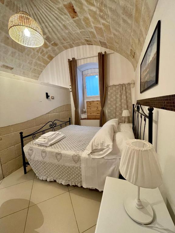 A bed or beds in a room at Dimora Aversa