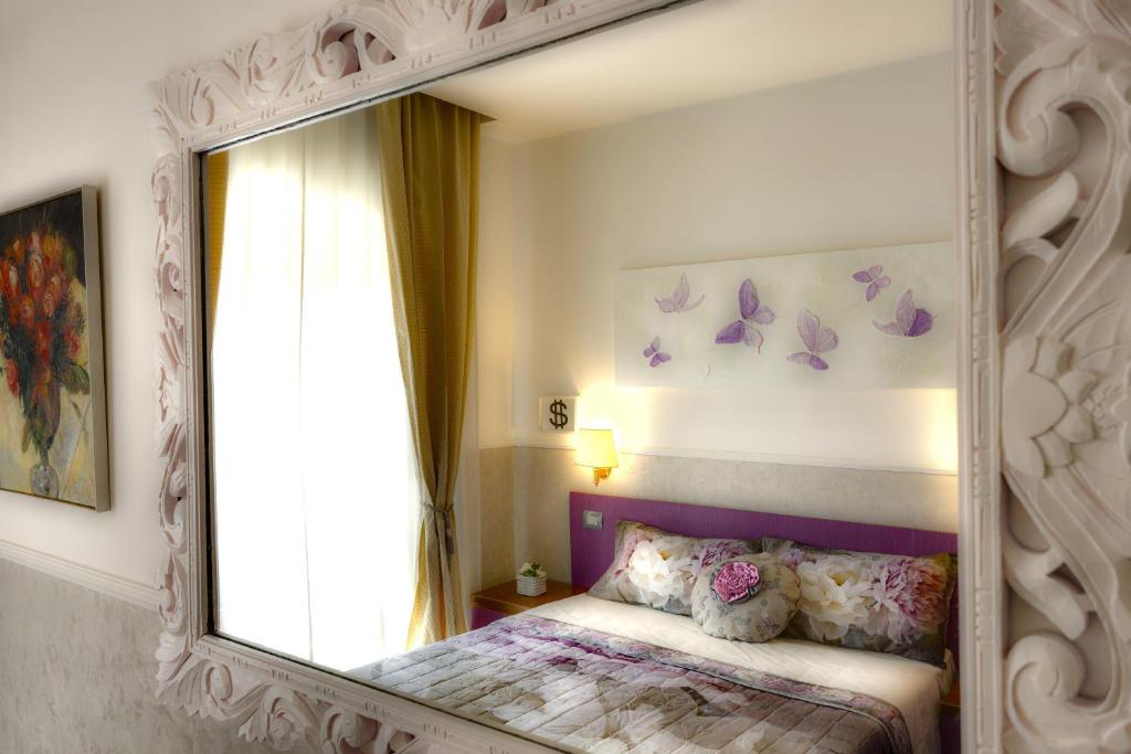 Postel nebo postele na pokoji v ubytování Hotel Marcantonio