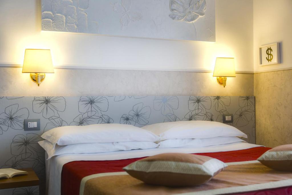 Postel nebo postele na pokoji v ubytování Hotel Marcantonio