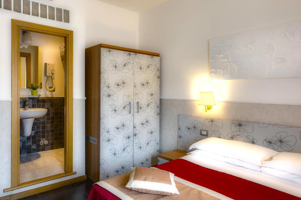 Postel nebo postele na pokoji v ubytování Hotel Marcantonio