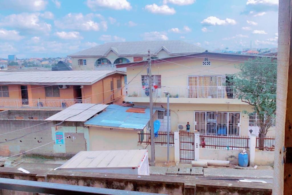 a view of a house from a window at Maleeks Apartment Ikeja "Shared 2Bedroom Apt, individual private rooms and baths" in Lagos