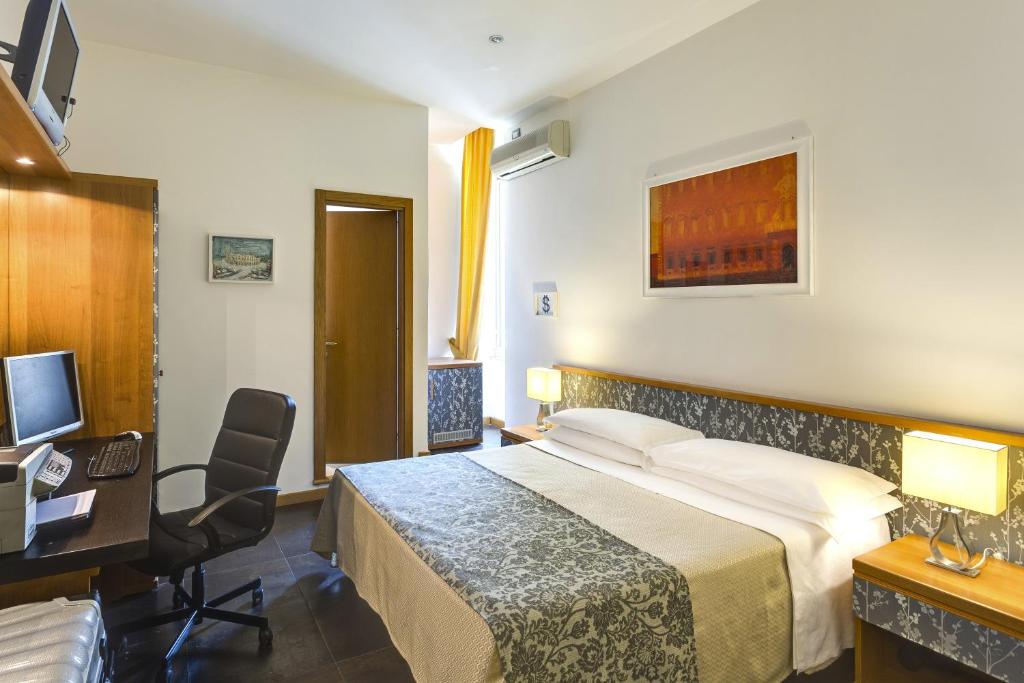 Postel nebo postele na pokoji v ubytování Hotel Marcantonio