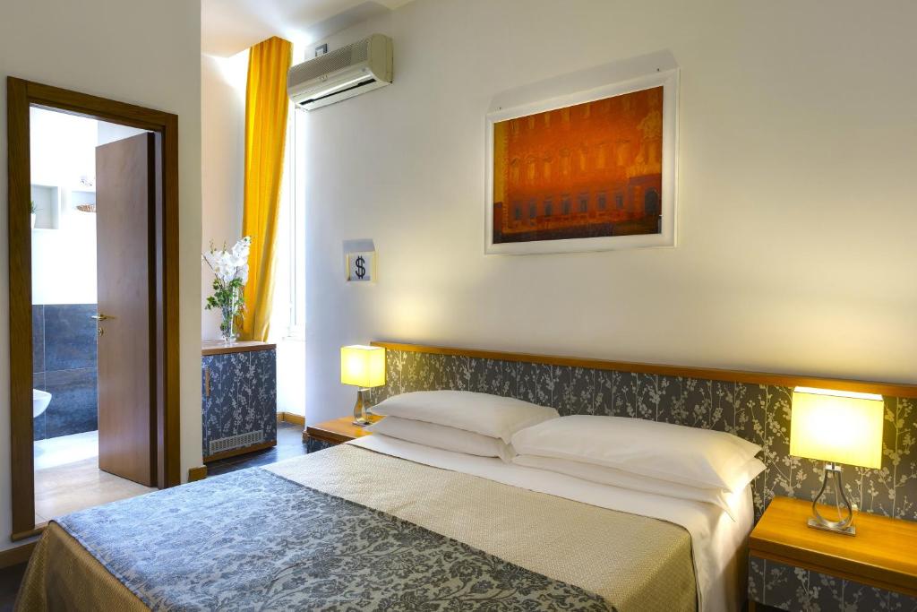 Postel nebo postele na pokoji v ubytování Hotel Marcantonio
