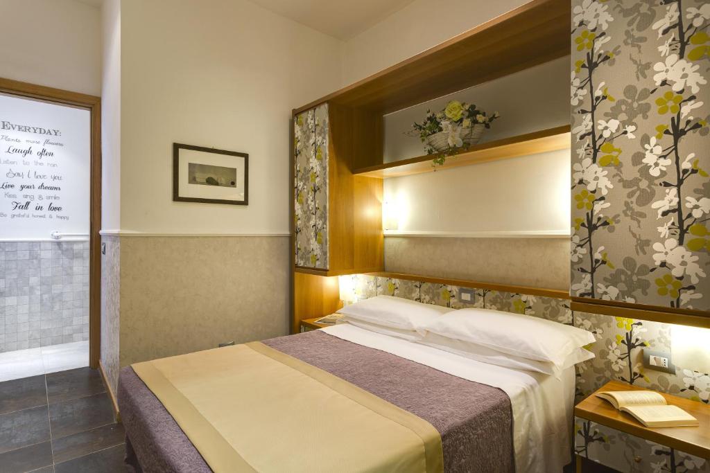 Postel nebo postele na pokoji v ubytování Hotel Marcantonio
