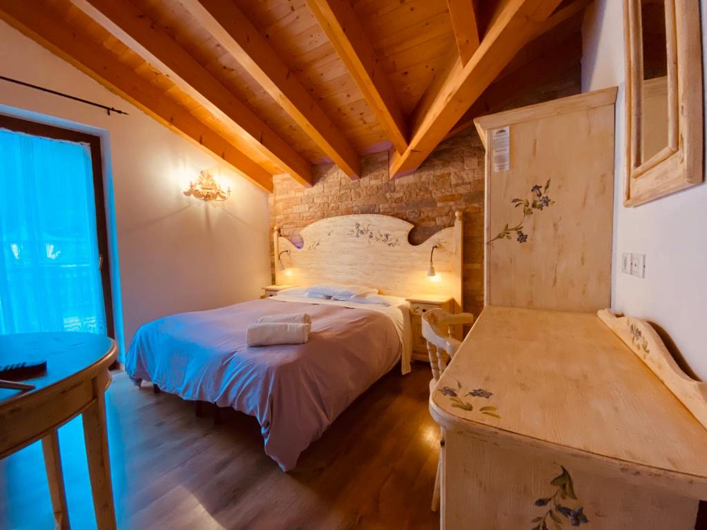 Postel nebo postele na pokoji v ubytování B&B Le Coccole